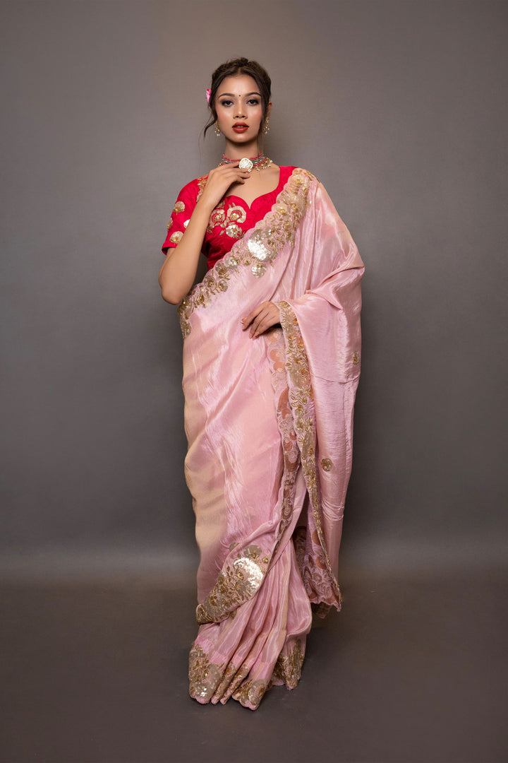 A pastel pink saree with intricate gotapatti and pitta work on the pallu and border, paired with stitched designer blouse - Mayrake