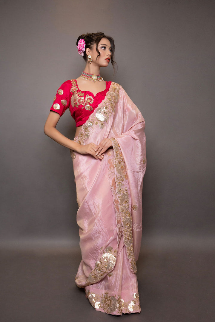 A pastel pink saree with intricate gotapatti and pitta work on the pallu and border, paired with stitched designer blouse - Mayrake