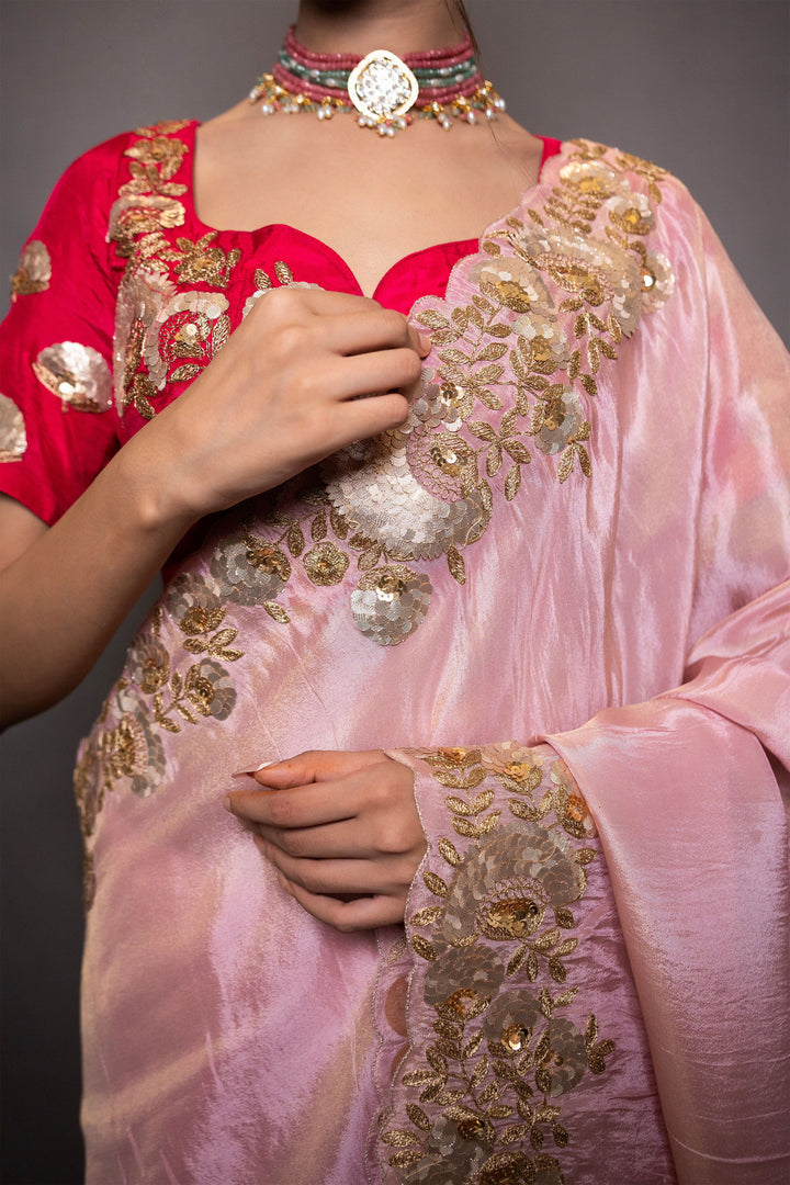 A pastel pink saree with intricate gotapatti and pitta work on the pallu and border, paired with stitched designer blouse - Mayrake