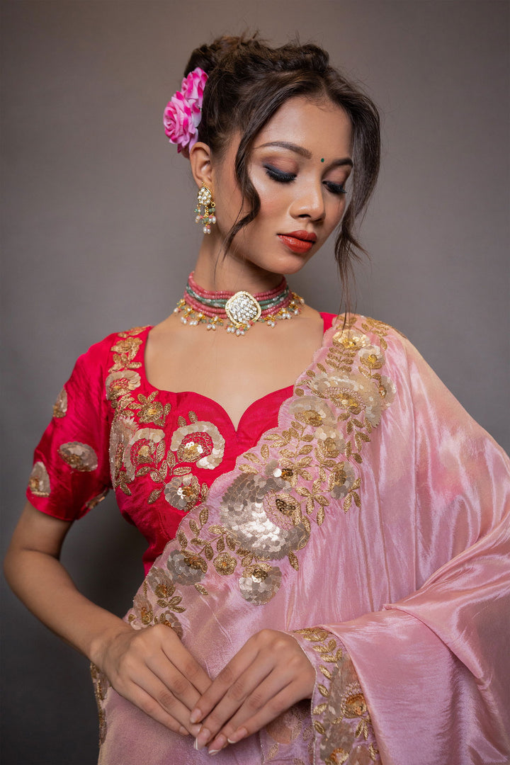 A pastel pink saree with intricate gotapatti and pitta work on the pallu and border, paired with stitched designer blouse - Mayrake