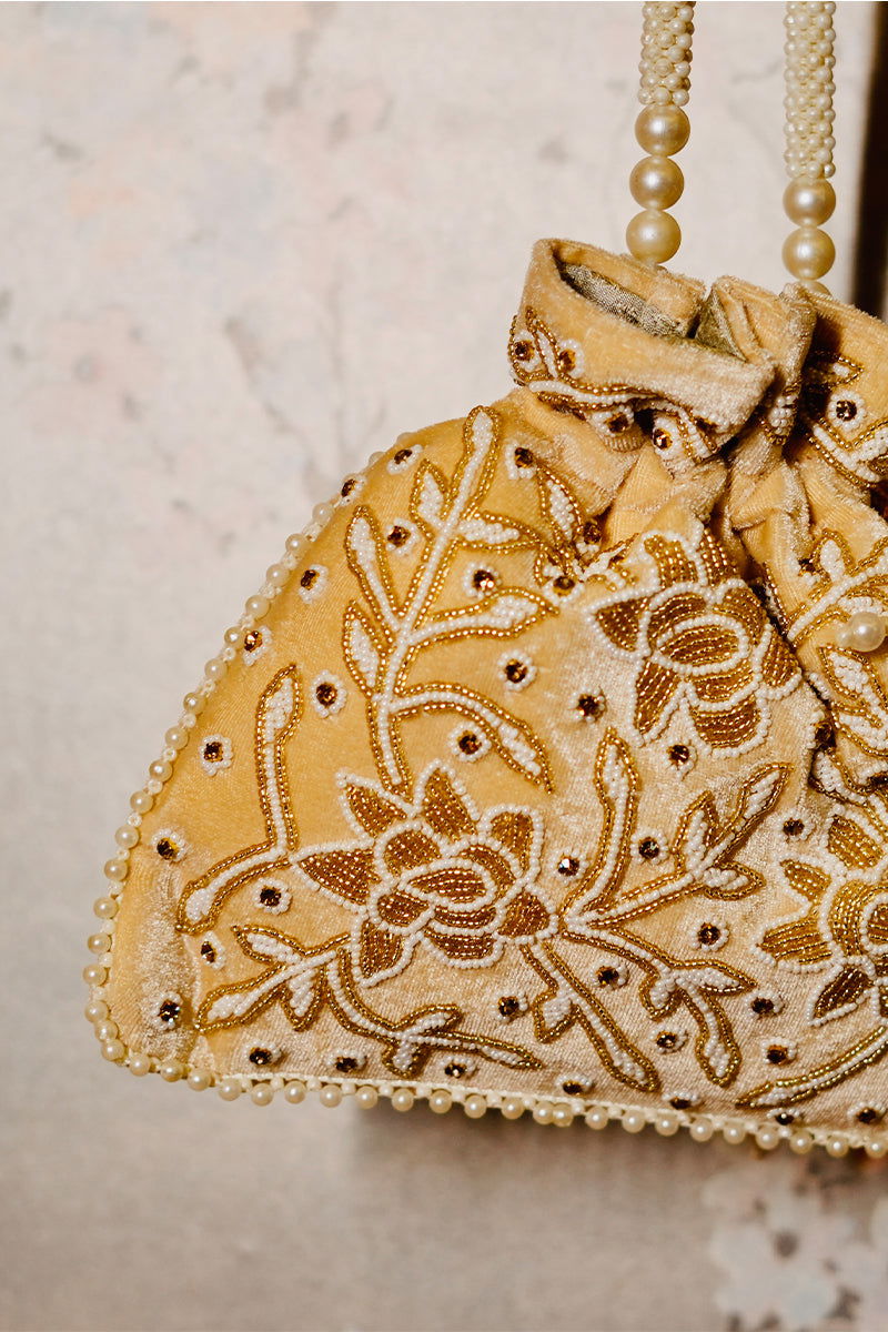 Handwork Beige Pearl and Bead Potli with Pearl Handle and Velvet Base - Mayrake.in