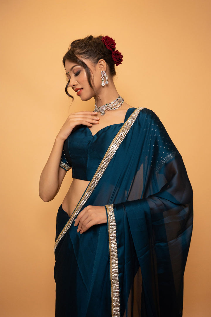 Peacock Blue Georgette Saree with Cutdana and Swarovski Work and Lace with a designer Blouse - Mayrake